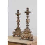 A pair of baroque carved giltwood candlestands,