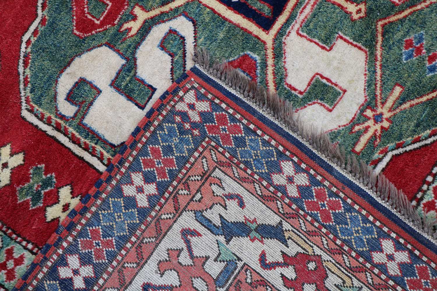 A hand knotted Kazak wool rug - Image 2 of 2