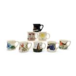 A collection of Moorcroft pottery mugs,