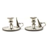 A pair of George III silver chambersticks,