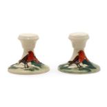 A pair of Moorcroft pottery ‘Christmas Robin’ dwarf candlesticks