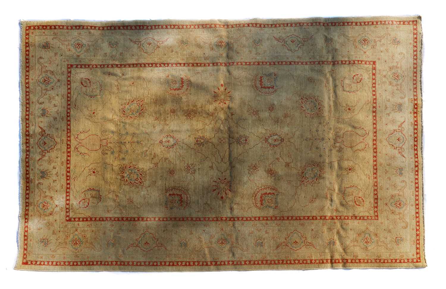 A wool rug of Persian Ziegler design,