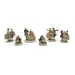 A collection of six German porcelain figure groups,