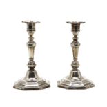 A pair of 1930s silver candlesticks,