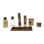 A leather cased vanity set,