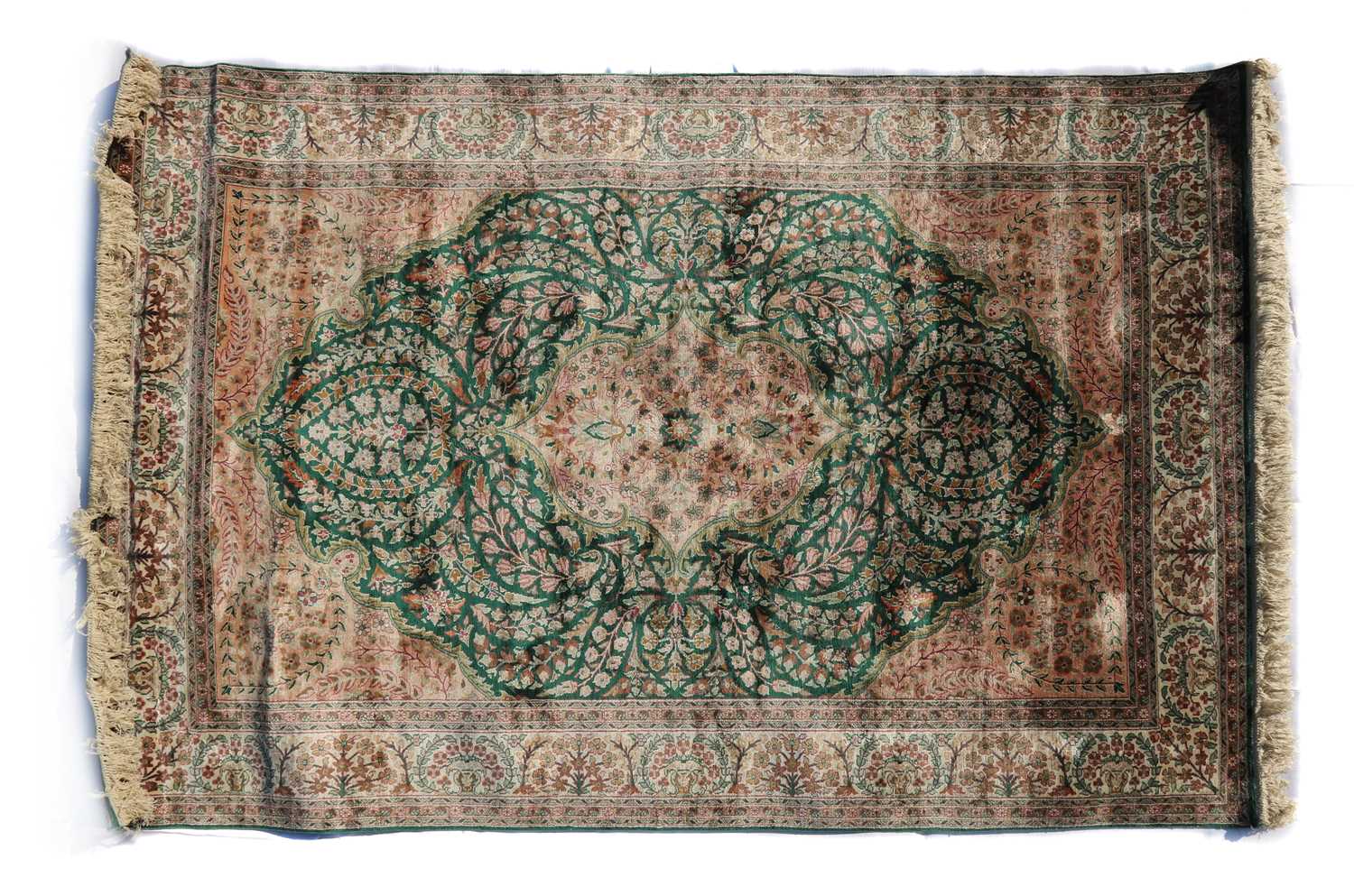 A Persian style silk rug,