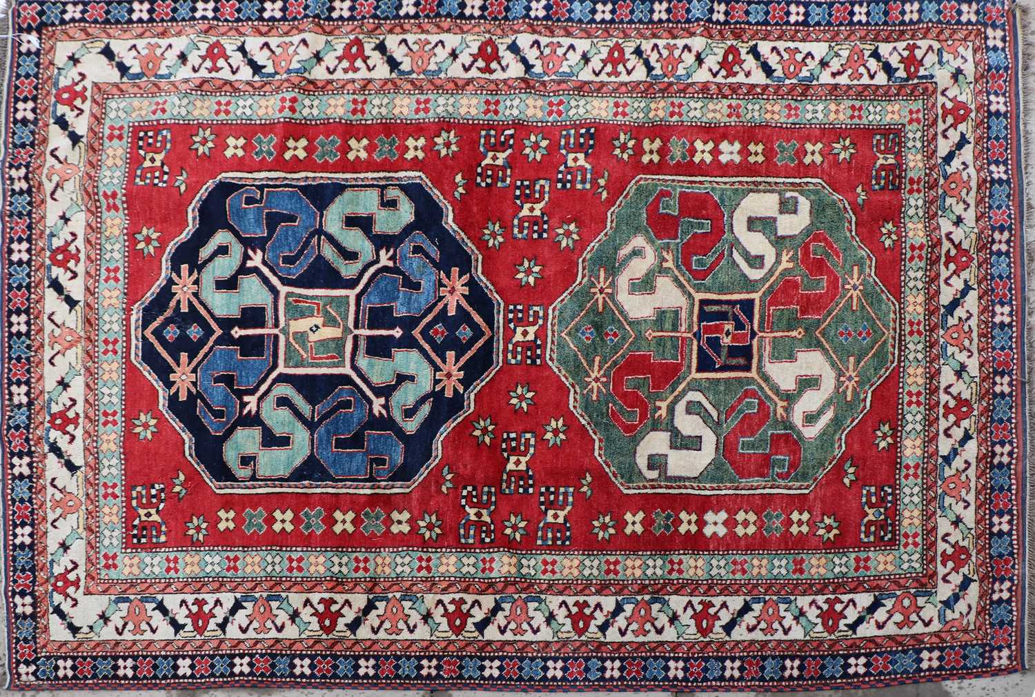 A hand knotted Kazak wool rug
