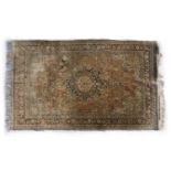 A Persian silk rug,