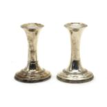 A pair of Edwardian silver dwarf candlesticks