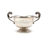 A silver twin handled pedestal cup