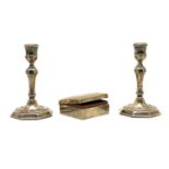 A pair of Queen Anne style silver candlesticks,