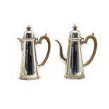 A silver chocolate pot and hot water jug set,