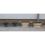 Two pairs of cast iron garden urns,