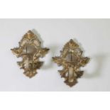 A pair of baroque carved, gilt and silvered wood, pricket wall sconces,