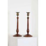A pair of George III mahogany candlesticks,