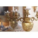 A George III ormolu three-light candelabrum,