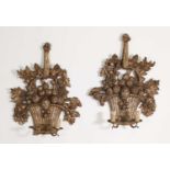 A pair of carved giltwood wall lights,