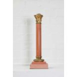 A rouge marble table lamp,