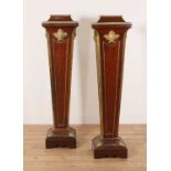 A pair of mahogany pedestals,