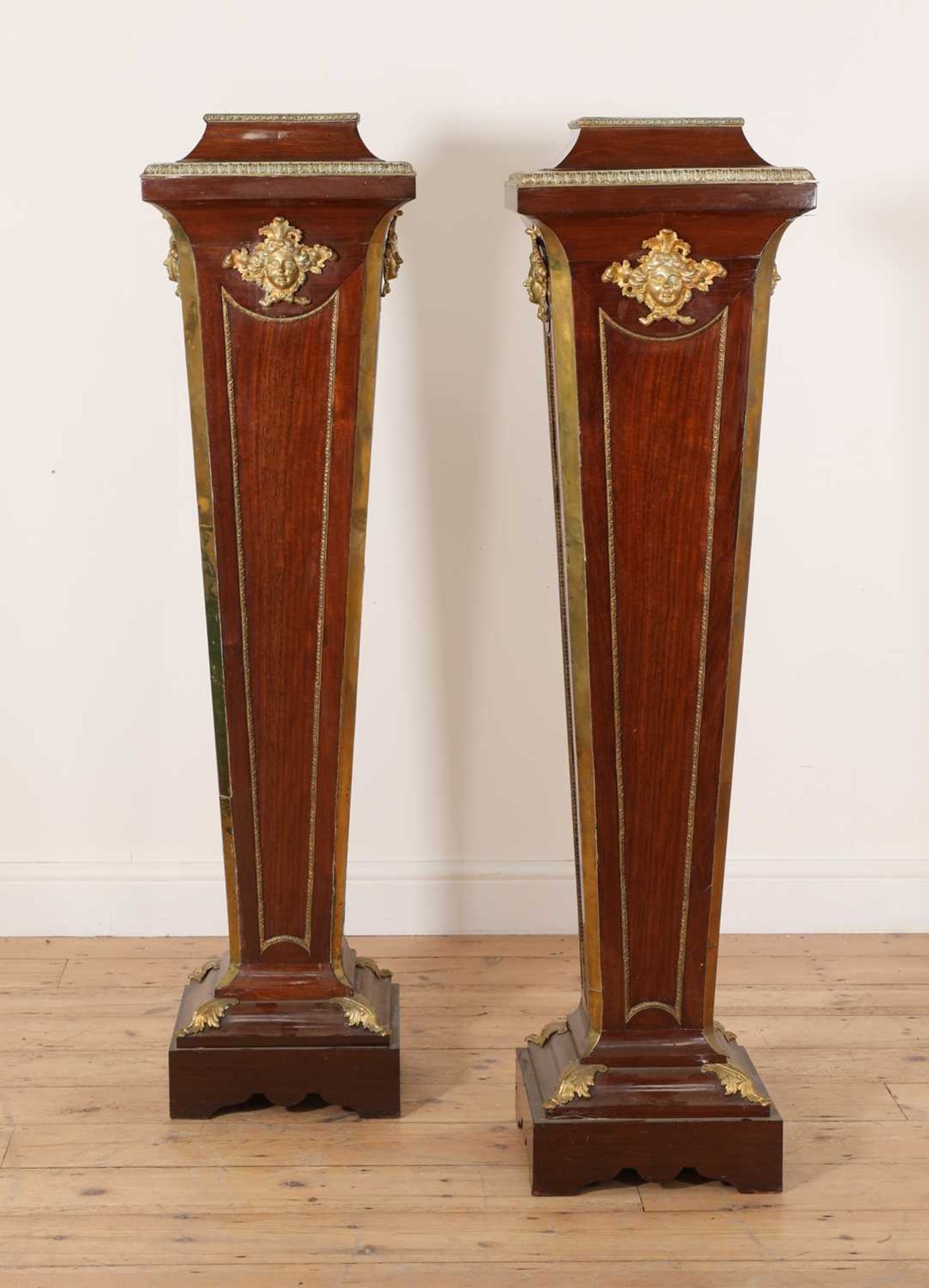 A pair of mahogany pedestals,