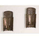 A pair of pressed brass wall sconces,