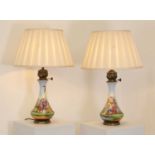 A pair of Napoleon III porcelain oil lamps,