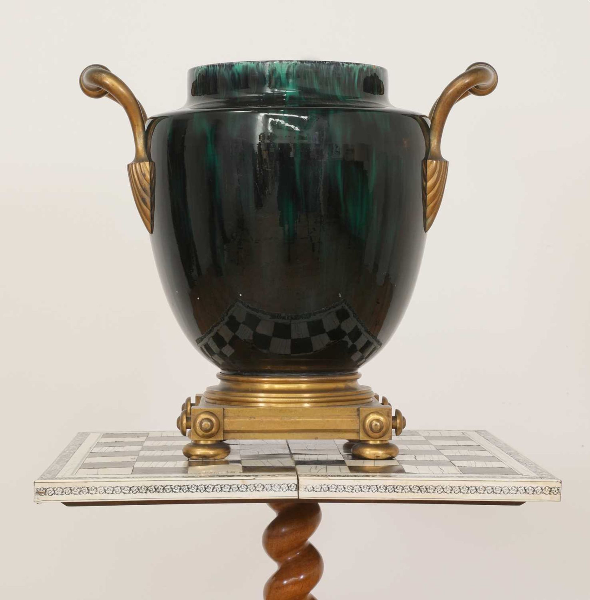 A green flambé-glazed faience urn,