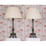 A pair of Louis Phillipe parcel-gilt bronze sinumbra table lamps,