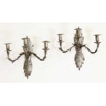 A pair of Iberian tinned toleware three-candle wall lights,