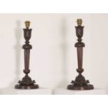 A pair of Edwardian carved mahogany table lamps,