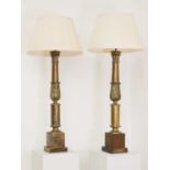 A pair of tall lacquered brass table lamps,