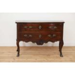 A dated Louis XV walnut commode,