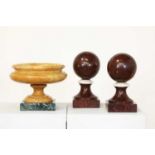 A pair of Rouge Griotte marble balls,