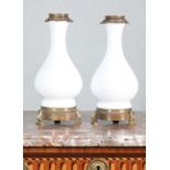 A pair of white opaline glass table lamps,