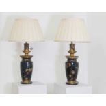 A pair of Orientalist patinated and gilt metal moderator lamps,