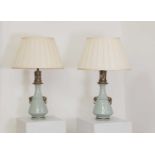 A pair of Napoleon III celadon-glazed pottery table lamps,