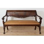 A carved mahogany settee,