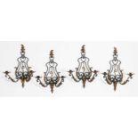 A set of four French wrought iron wall lights,