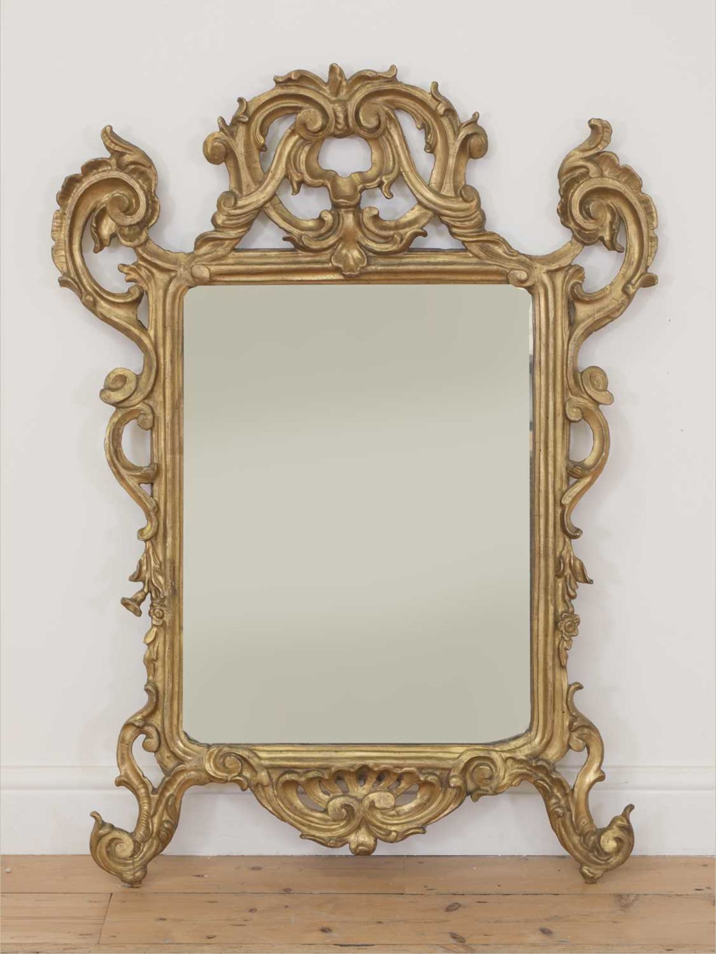 A baroque carved giltwood wall mirror,