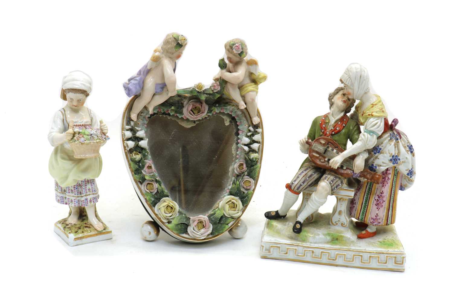 A Dresden porcelain figure group of a hurdy-gurdy player and lady,