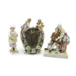 A Dresden porcelain figure group of a hurdy-gurdy player and lady,