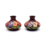 A pair of Moorcroft pottery ‘Pansy’ pattern vases,