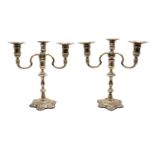 A pair of silver candelabra,