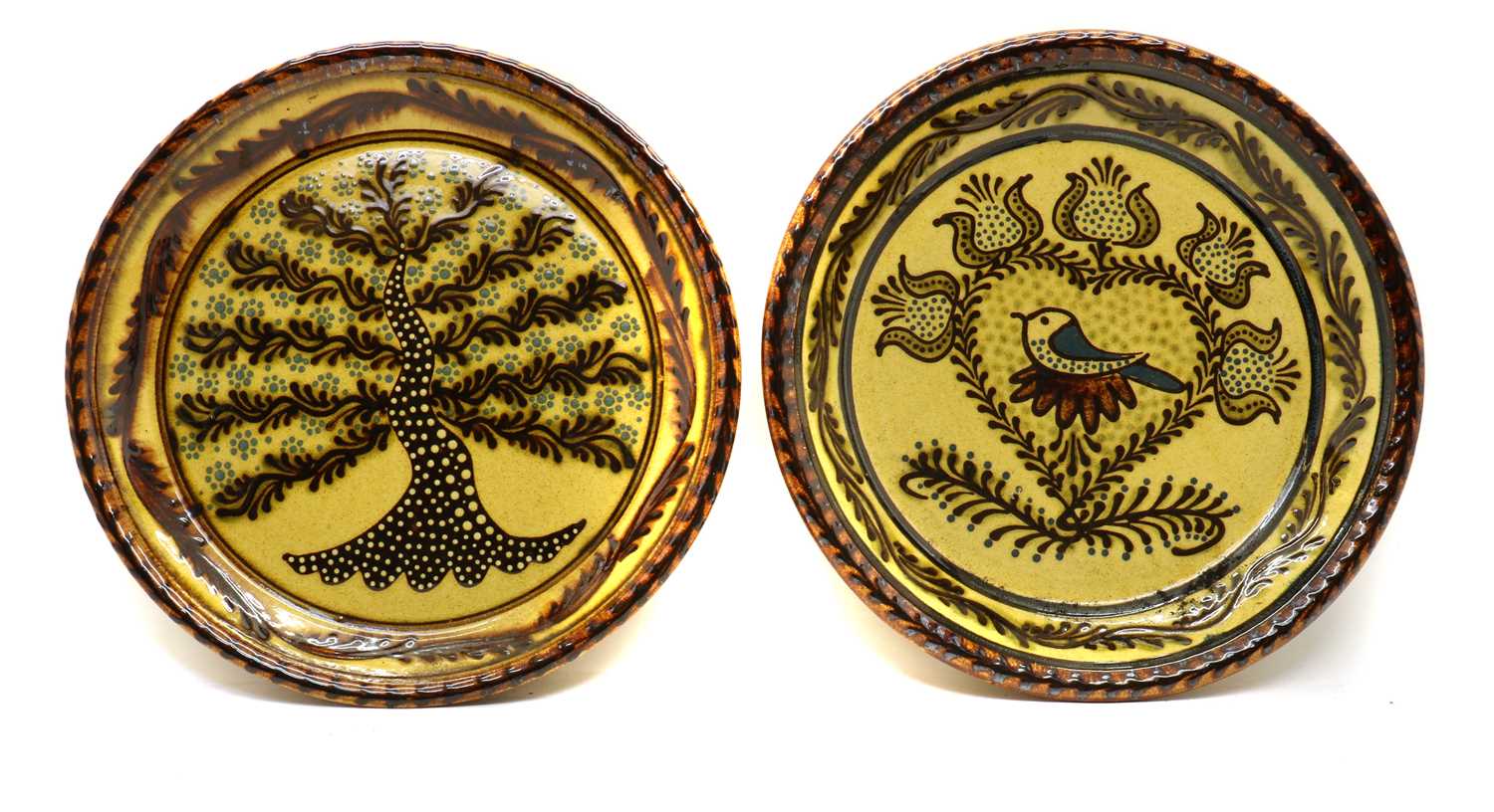 A pair of slipware chargers,