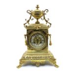 A late 19th century brass clock,