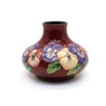 A Moorcroft pottery ‘Pansy’ pattern vase,