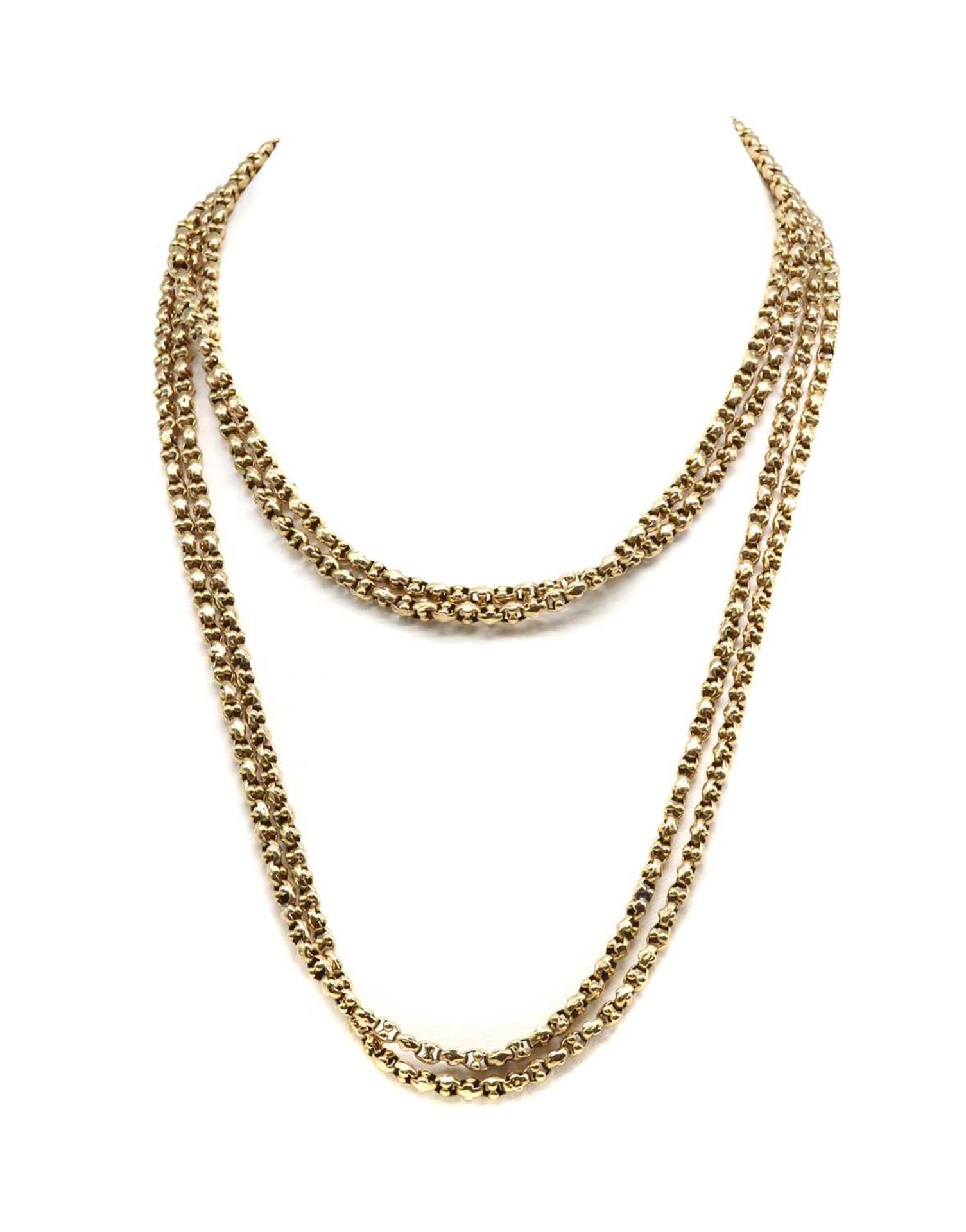An early 20th century gold long chain,