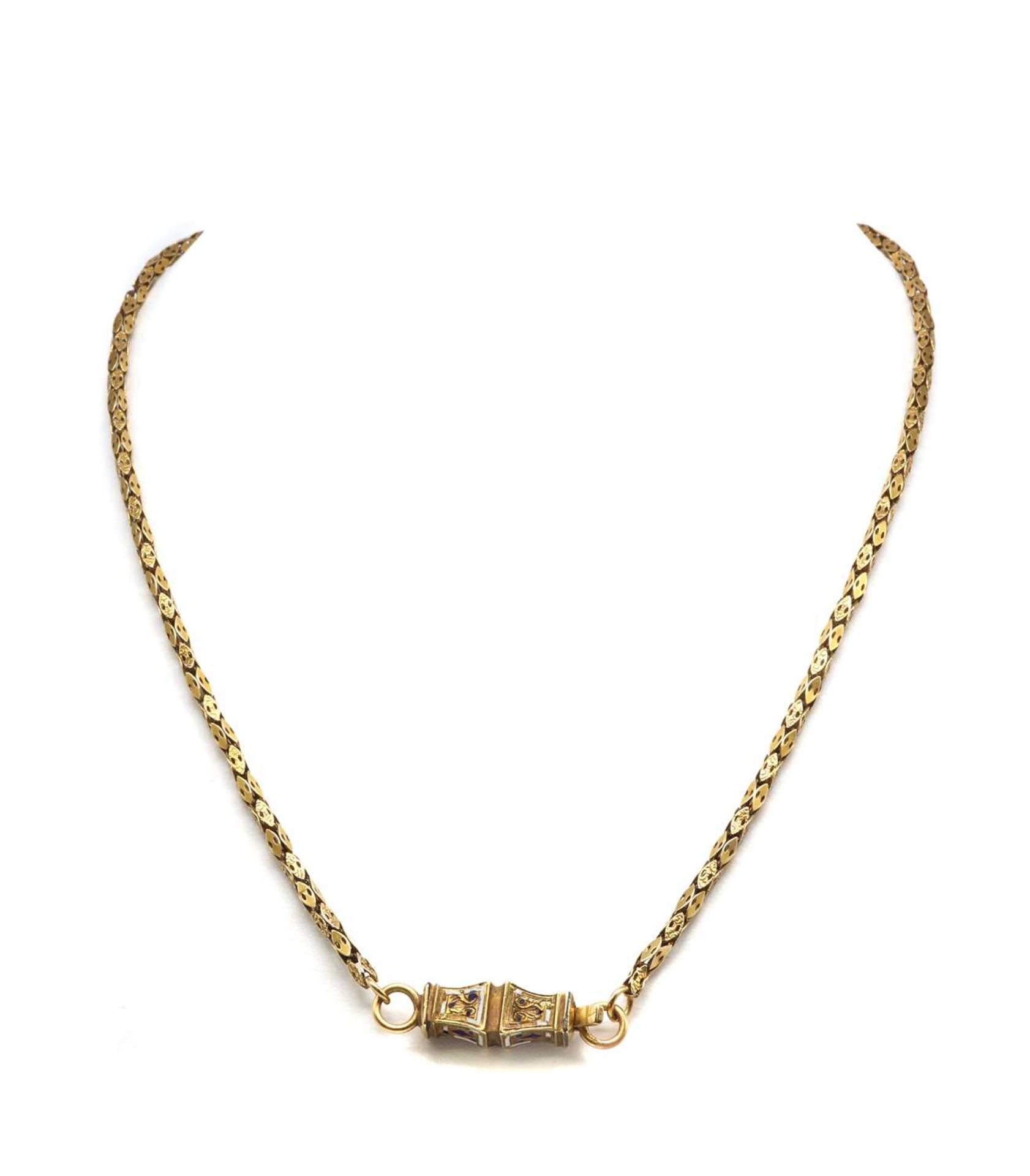 A gold chain with enamel clasp,