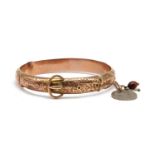 A 9ct gold hollow hinged bangle,