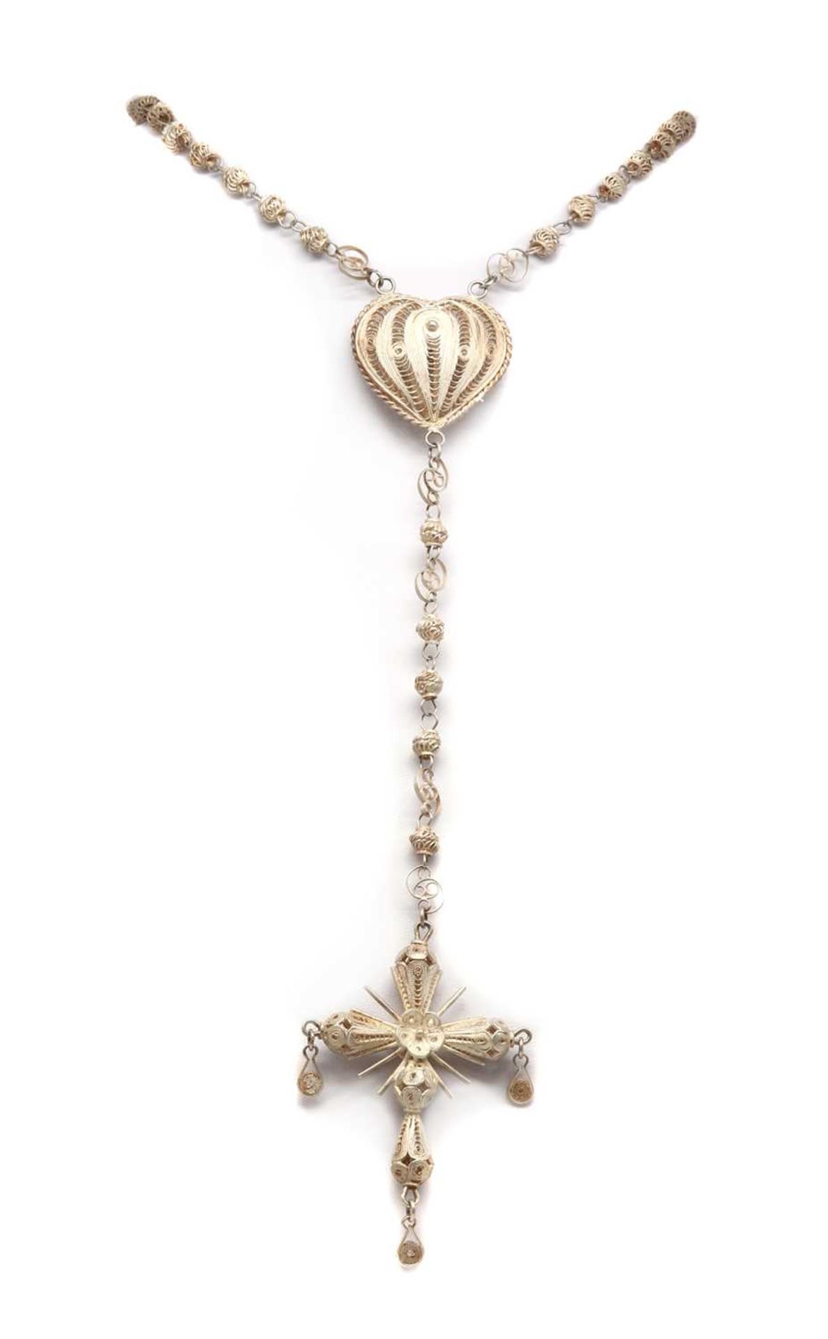 A silver filigree rosary,